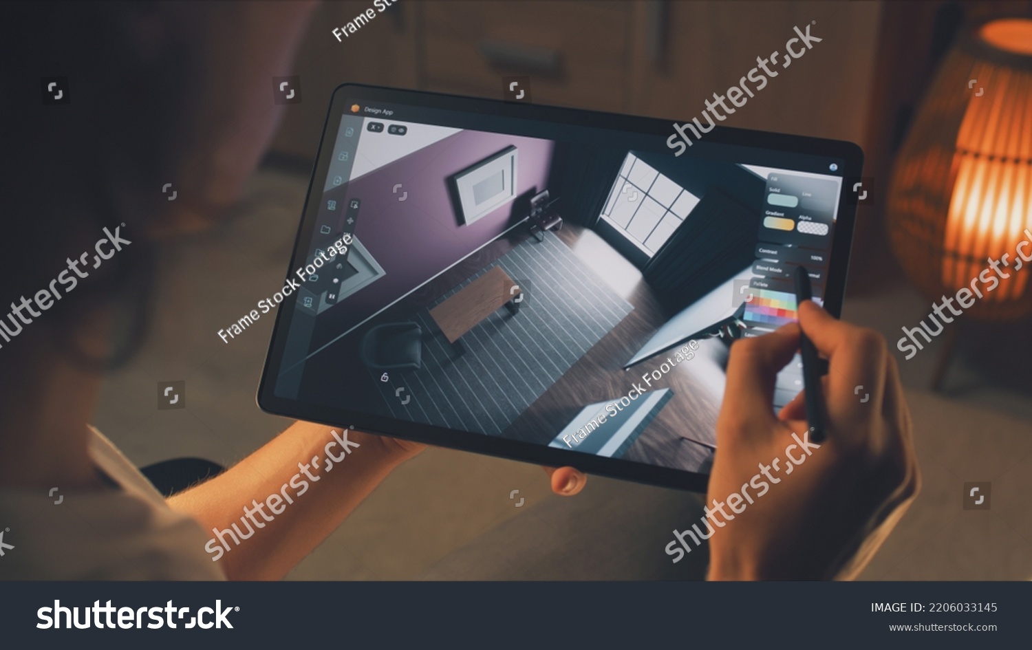 stock-photo-male-d-designer-using-digital-tablet-computer-and-pencil-and-creating-interior-of-house-in-2206033145