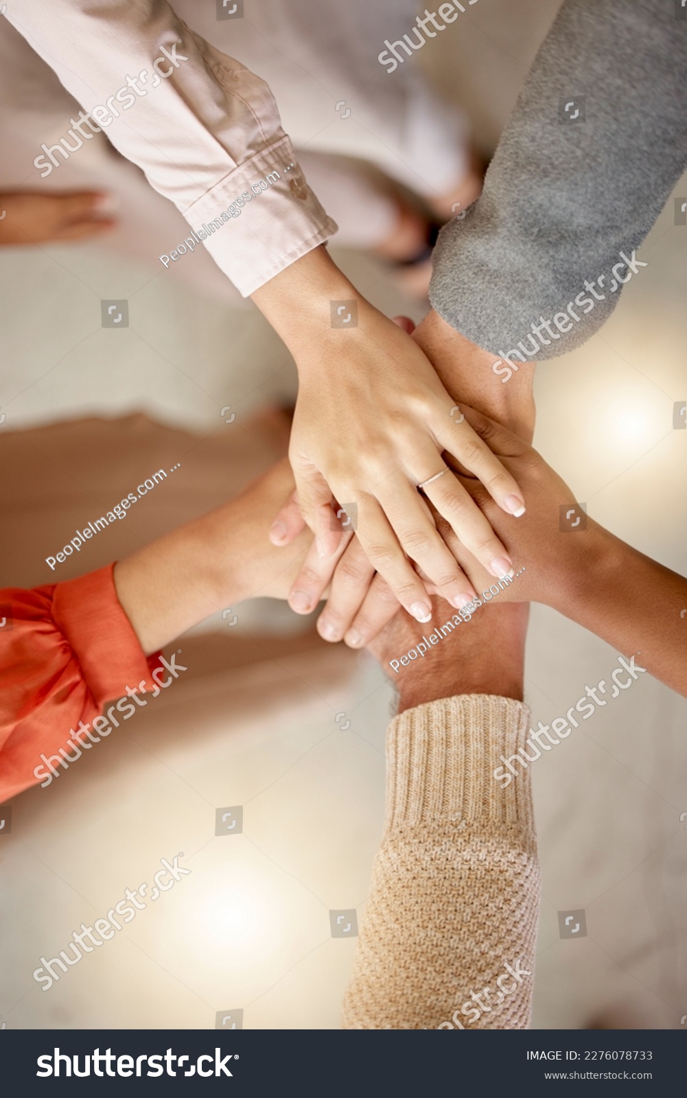 stock-photo-team-building-top-view-or-hands-in-meeting-together-on-a-business-or-group-project-for-motivation-2276078733